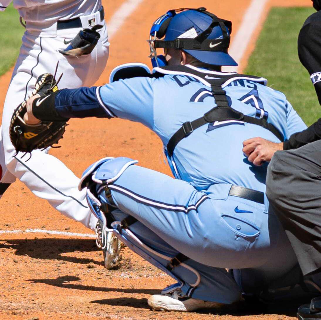 baseball catcher in blue uniform