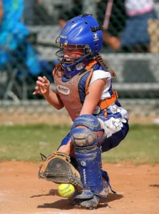 Image of a Fastpitch Catcher Squashing a Dirt Ball